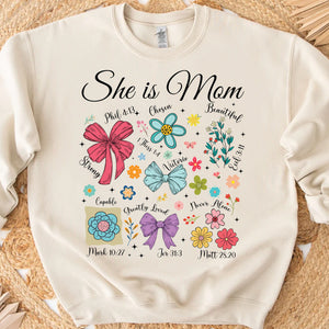 She Is Mom Sweatshirt – Faith-Based Christian Mother's Day Shirt With Bible Verses, Floral And Bow Coquette Design 682152