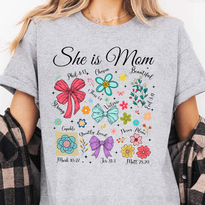 She Is Mom Sweatshirt – Faith-Based Christian Mother's Day Shirt With Bible Verses, Floral And Bow Coquette Design 682152