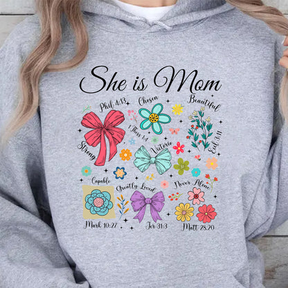 She Is Mom Sweatshirt – Faith-Based Christian Mother's Day Shirt With Bible Verses, Floral And Bow Coquette Design 682152